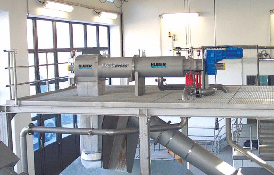 Sludge screening removes coarse and impurities and increases the operational reliability - here HUBER Coarse Material Separator STRAINPRESS®  HUBER sludge screening machines