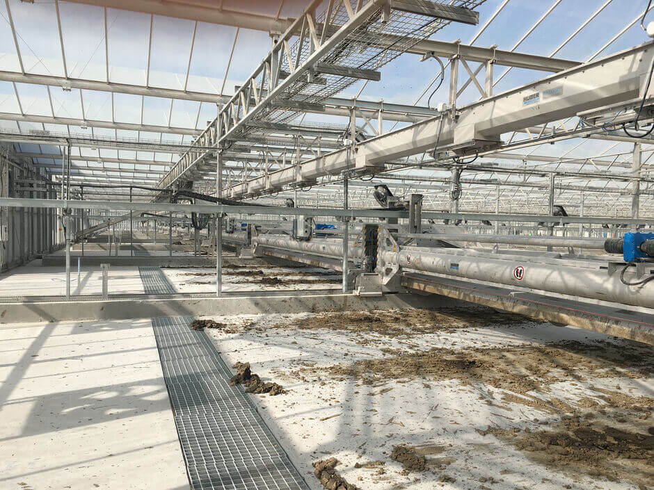 The screw conveyor installed in the floor collects the dry sludge The screw conveyor installed in the floor collects the dry sludge