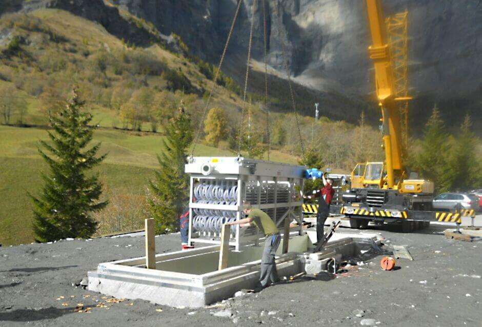 A HUBER Wastewater Heat Exchanger RoWin C is lifted into the concrete channel HUBER Heat Exchanger RoWin C tank version being lifted into the concrete tank