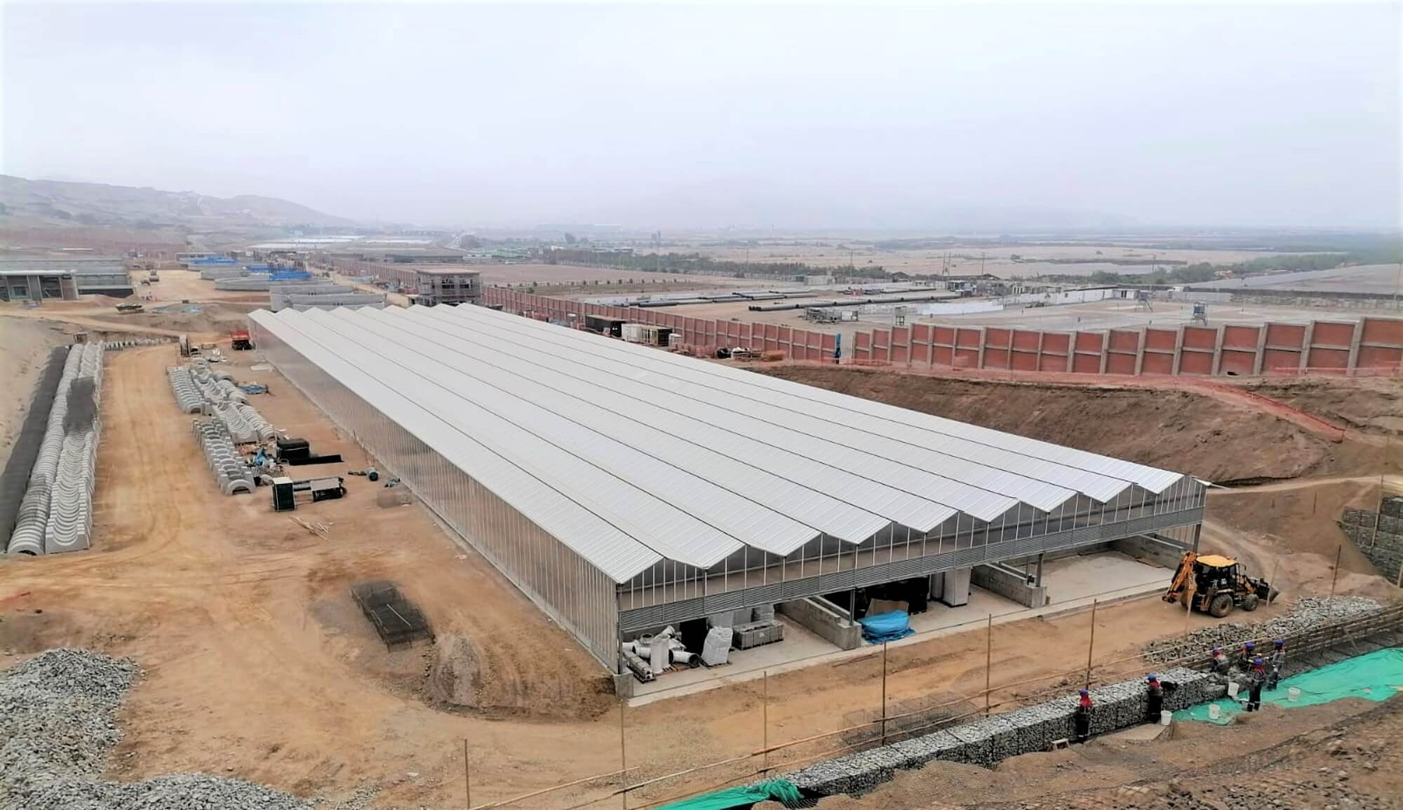 Aerial view of the impressive construction site with the greenhouses Aerial view of the impressive construction site with the greenhouses