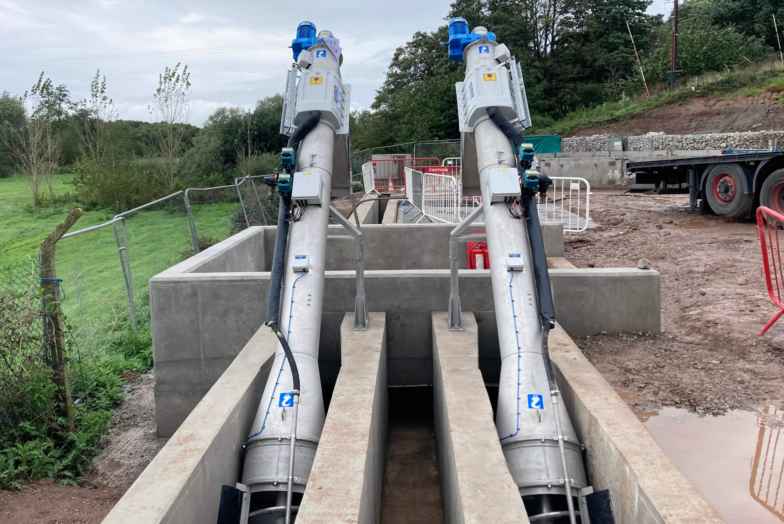 Two parallel HUBER Micro Strainer ROTAMAT® Ro9 in concrete channel during construction phase at Audlem, Cheshire  Two parallel HUBER Micro Strainer ROTAMAT® Ro9 in concrete channel during construction phase at Audlem, Cheshire